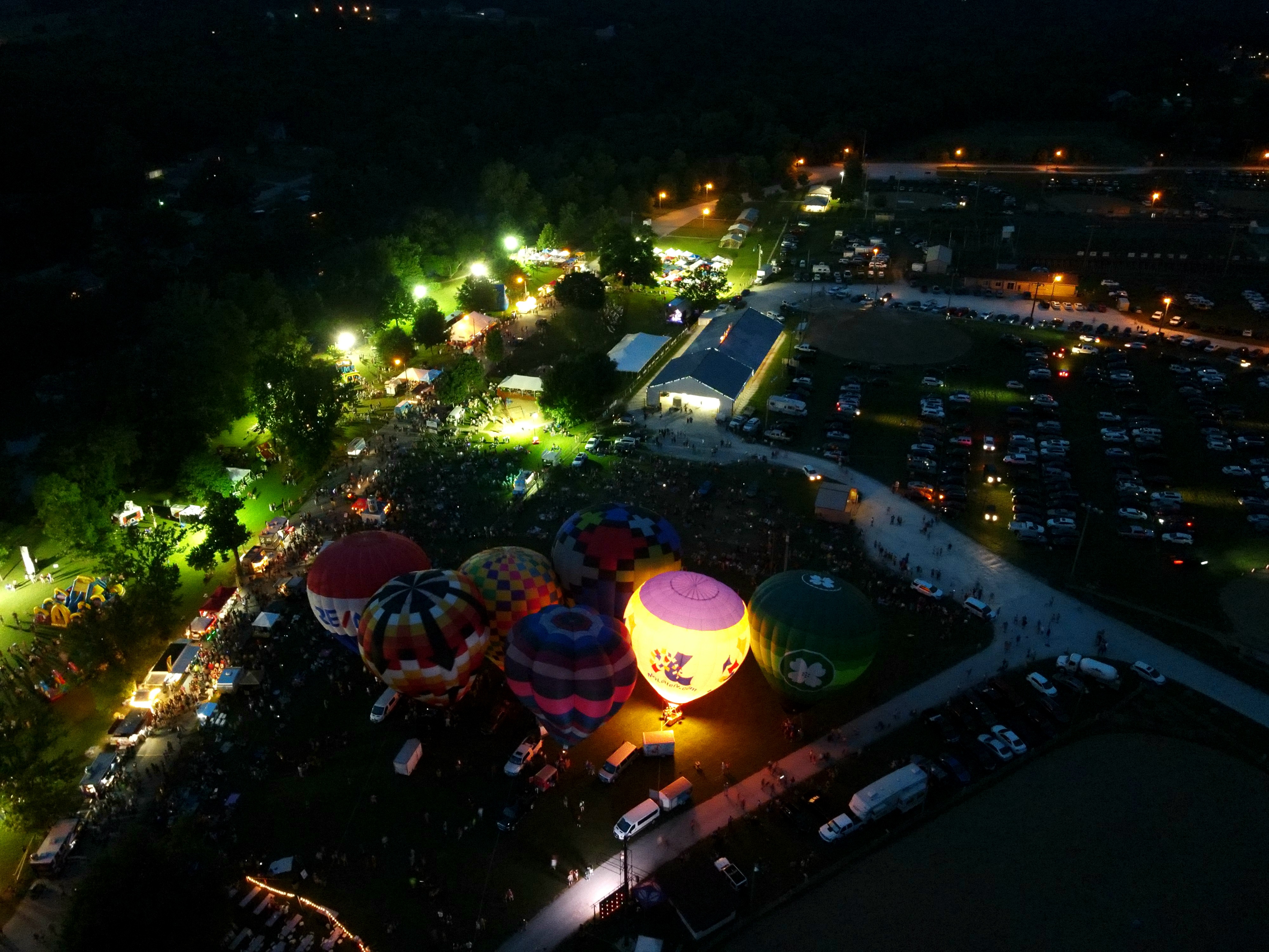 Aerial drone photo of a nighttime hot air balloon glow event in Republic, Missouri, shot by Christopher